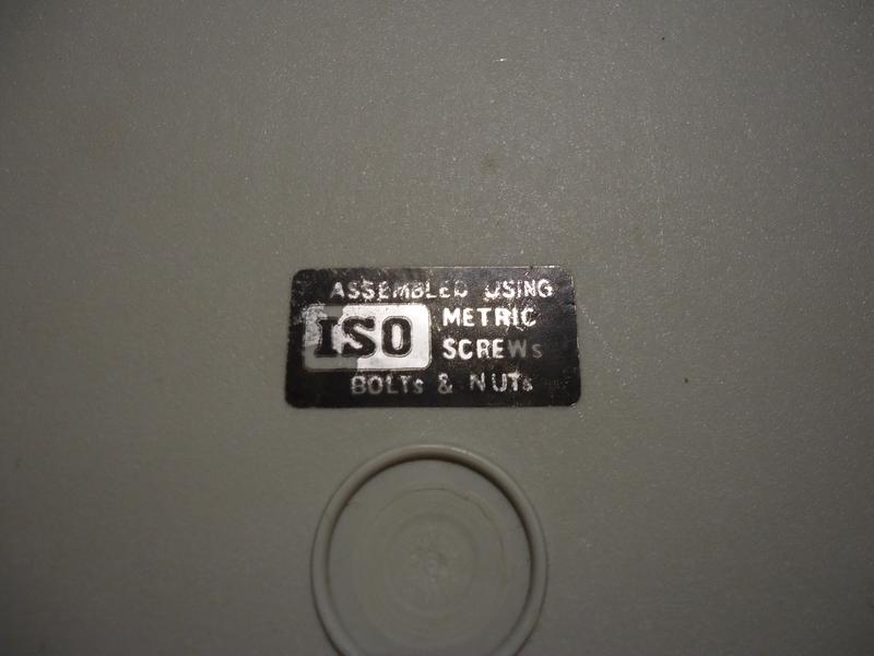 A black sticker saying "ASSEMBLED USING ISO METRIC SCREWS, BOLTS & NUTS" in shiny metal-grey letters.