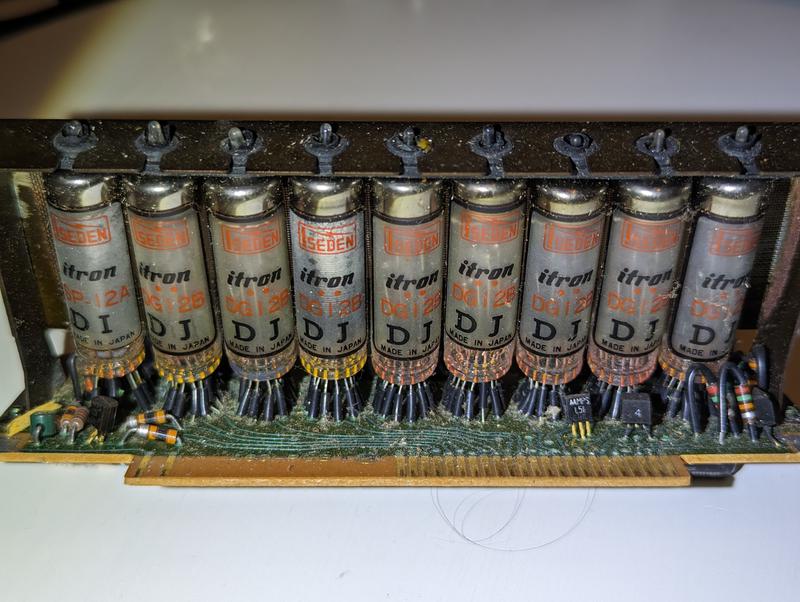 View of the back of the display block, showing the glass cylinders of the tubes.